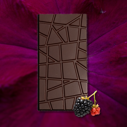 Blackberry Inclusion Chocolate bar with a geometric pattern on a purple surface with berries.