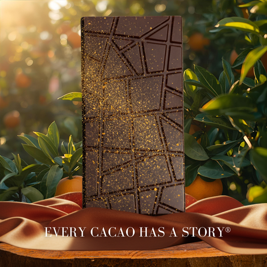 URKU's Dark chocolate bar with a geometric pattern on a wooden surface with greenery in the background